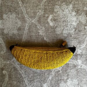 ANYA HINDMARCH
Banana Raffia Crossbody Bag